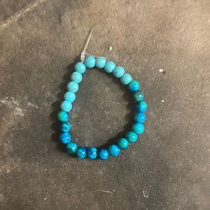 A small blue bracelet